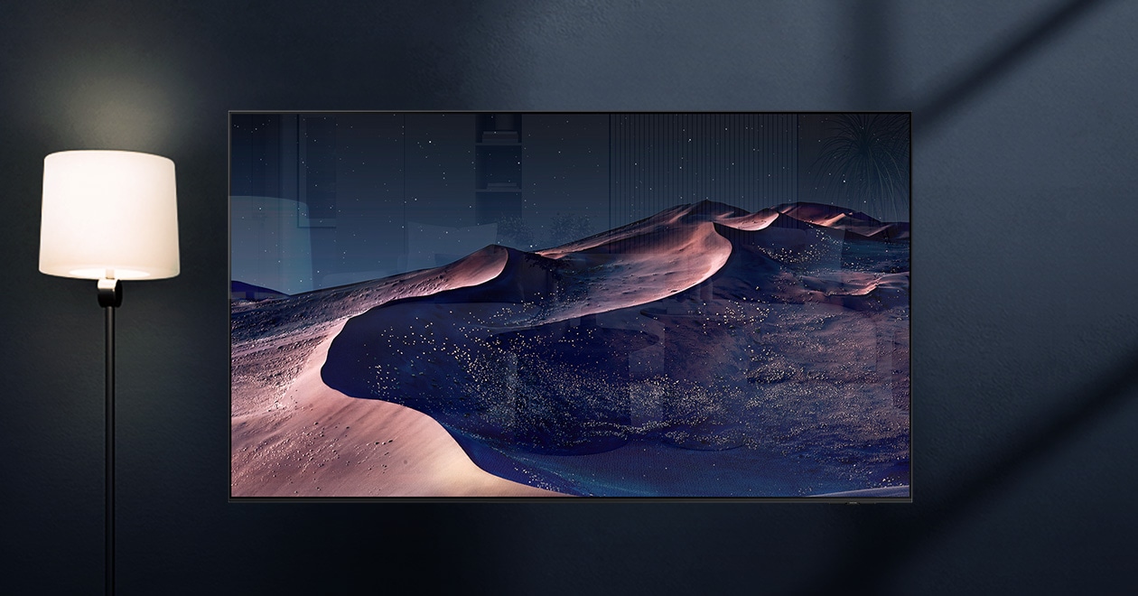 An OLED TV displays a scene of a desert on a starry night. A nearby lamp throws distracting reflections on the screen. With glare-free TV technology, the screen becomes clear. UL Verified Logo. Glare Free: Reflection Glare UGR < 10, Discomfort Glare < UGR 22, Disability Glare < 34. verifyUL.com®. V166045.